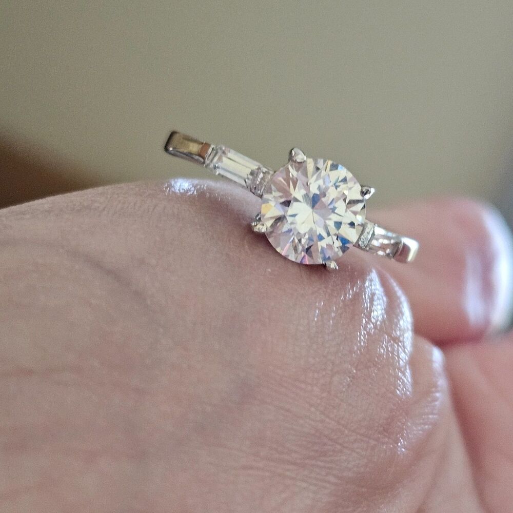 Silver tone ring with goshenite and clear rhinestones size 9